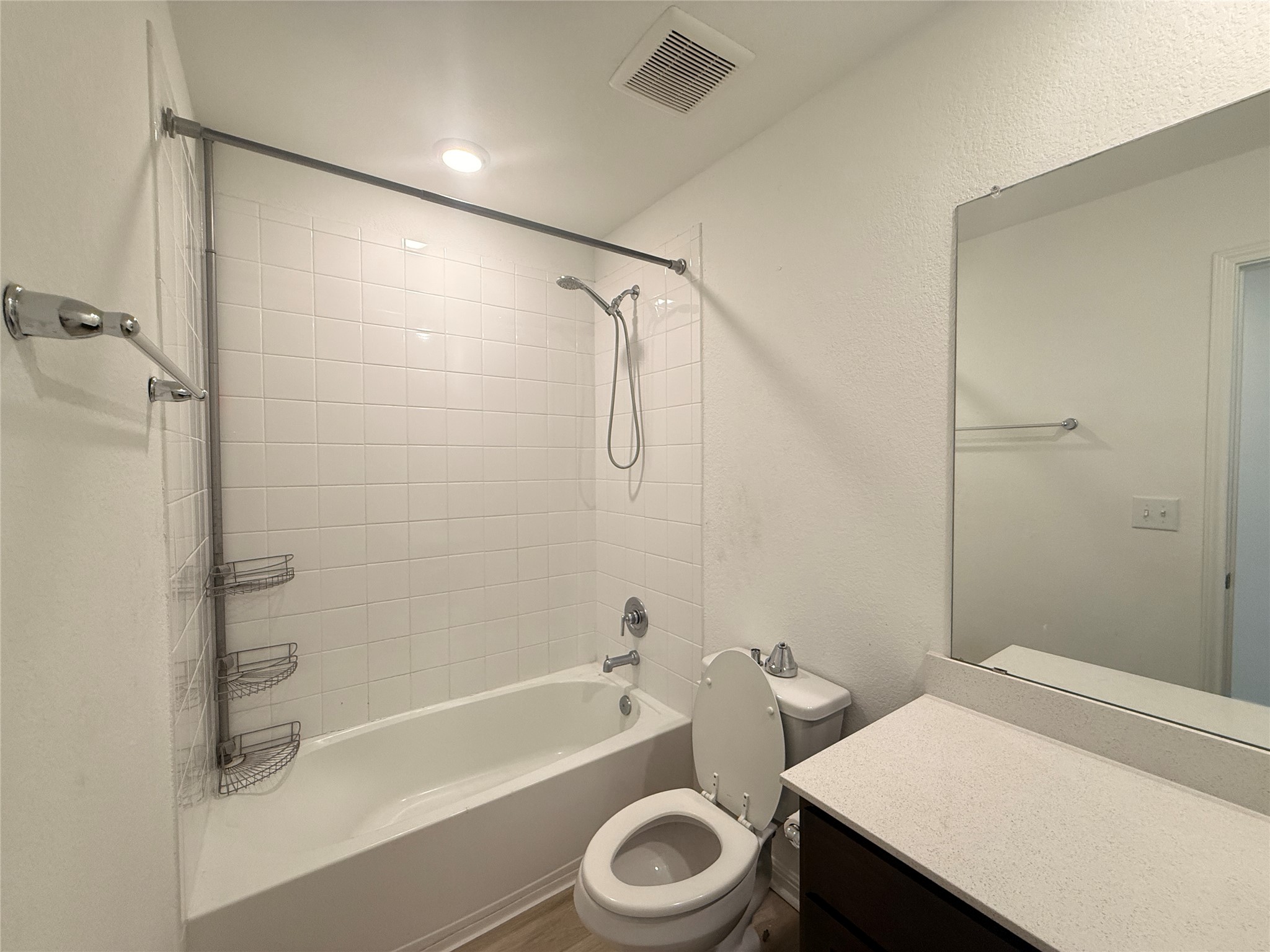 120 Calla Lane Georgetown, TX 78626 - Photo 14 of 19 Bathroom featuring vanity, washtub / shower combination, and a textured wall
