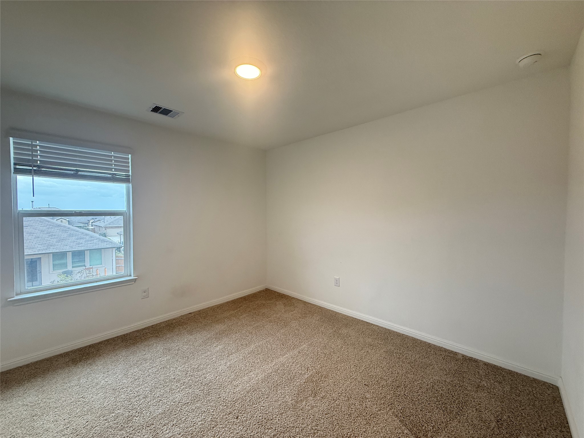 120 Calla Lane Georgetown, TX 78626 - Photo 16 of 19 Spare room featuring baseboards and carpet flooring