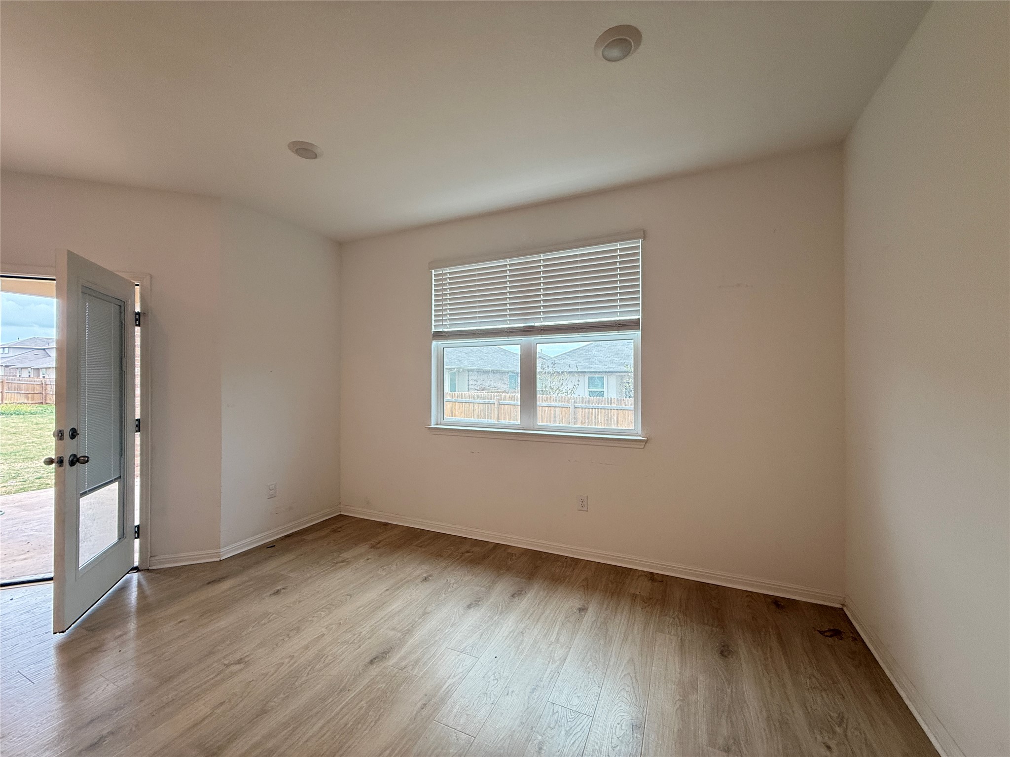 120 Calla Lane Georgetown, TX 78626 - Photo 2 of 19 Spare room featuring light wood finished floors and baseboards