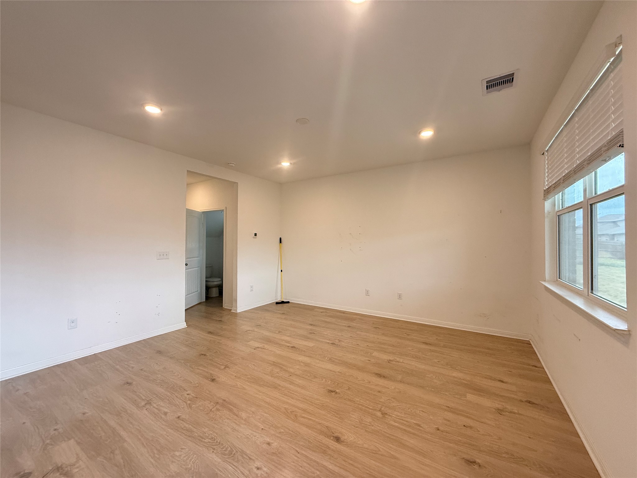 120 Calla Lane Georgetown, TX 78626 - Photo 5 of 19 Unfurnished room with light wood-style floors and recessed lighting