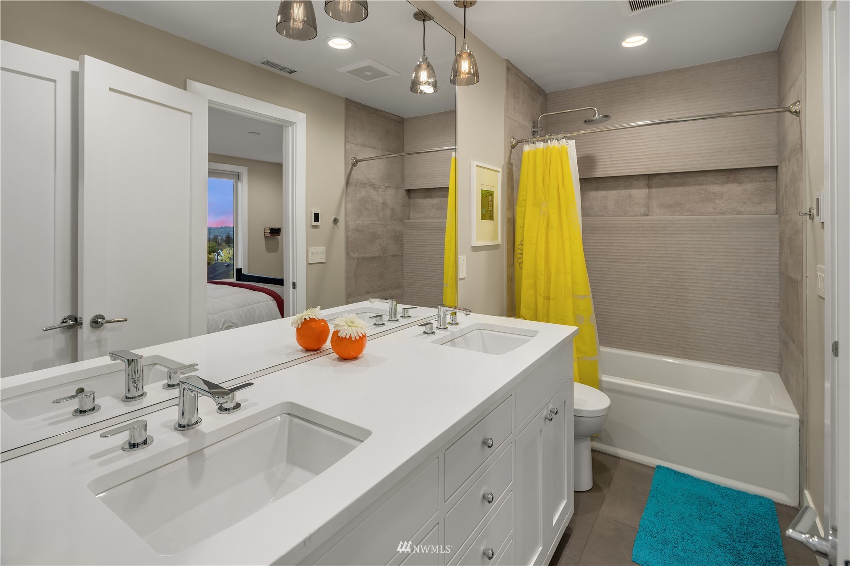 111 North 76th Street Seattle, WA 98103 - Photo 24 of 40 a bathroom with a sink double vanity granite tub shower and a mirror
