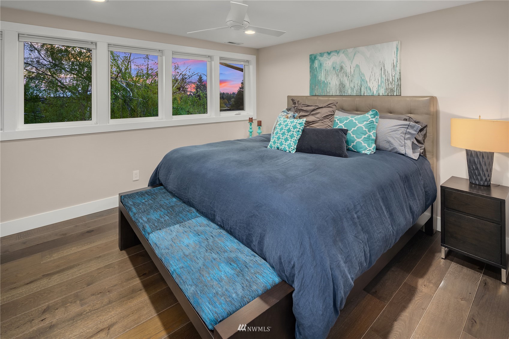 111 North 76th Street Seattle, WA 98103 - Photo 26 of 40 a bedroom with a bed and wooden floor