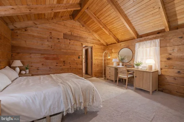 a bed room with a bed and furniture