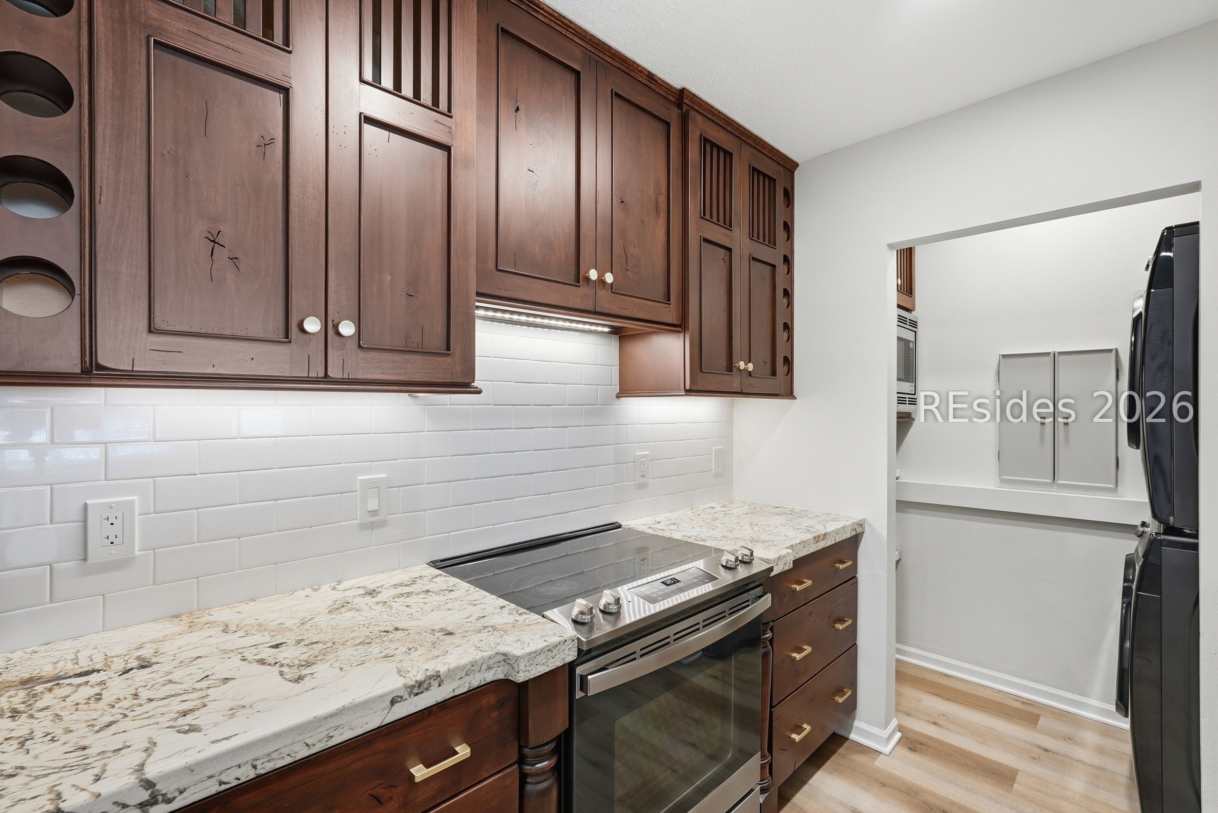897 Fording Island Road, Unit 1303 Bluffton, SC 29910 - Photo 11 of 48 Tile backsplash, abundant kitchen storage.