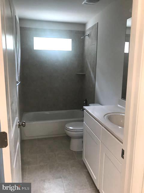 8363 WB&A Road Severn, MD 21144 - Photo 19 of 32 a bathroom with a toilet sink and shower