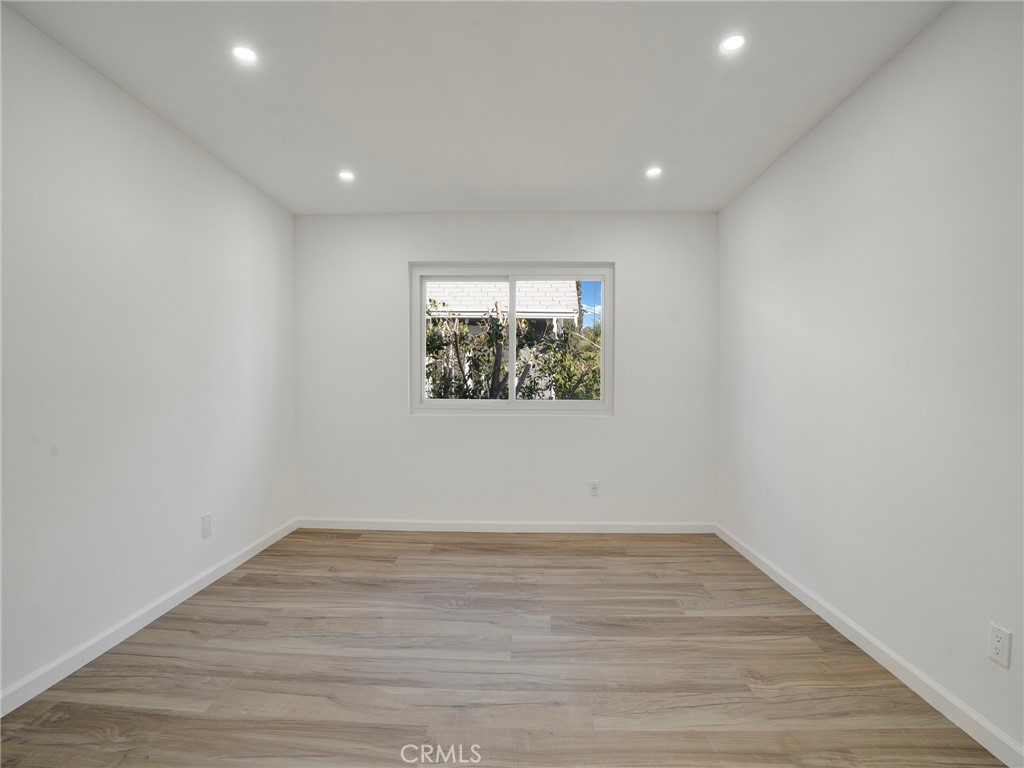 727 Robinson Street Los Angeles, CA 90026 - Photo 16 of 28 a view of room with wooden floor and window