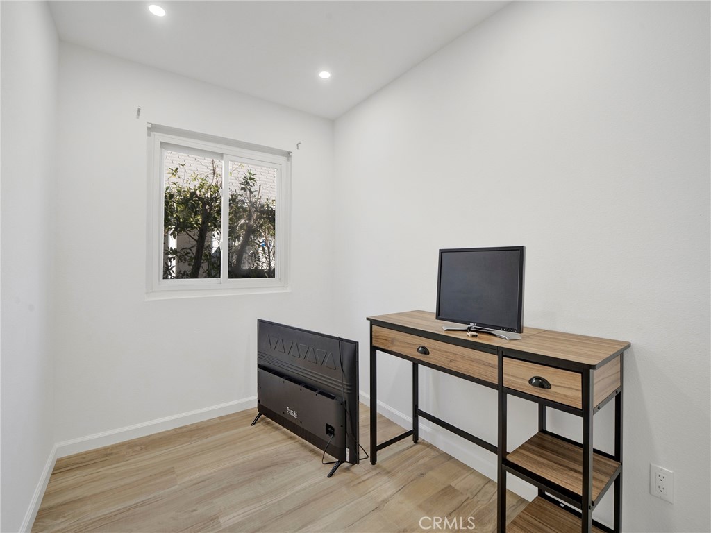 727 Robinson Street Los Angeles, CA 90026 - Photo 19 of 28 a view of workspace with wooden floor and cabinet