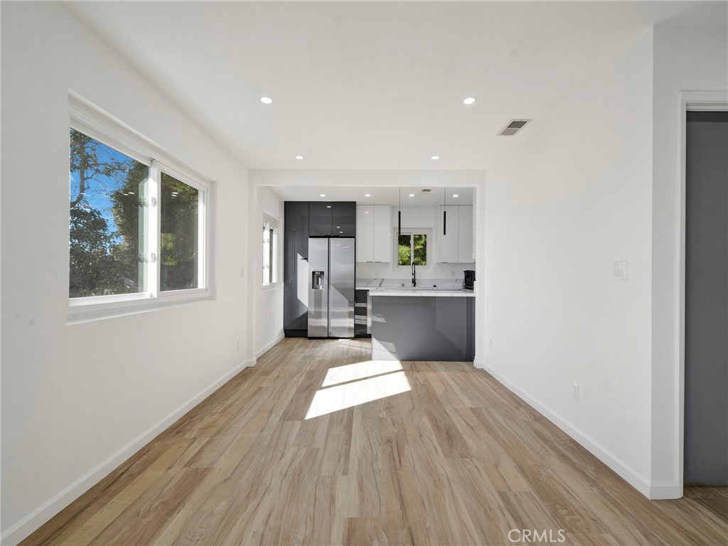 727 Robinson Street Los Angeles, CA 90026 - Photo 10 of 28 a living room with stainless steel appliances kitchen island wooden floors and view living room