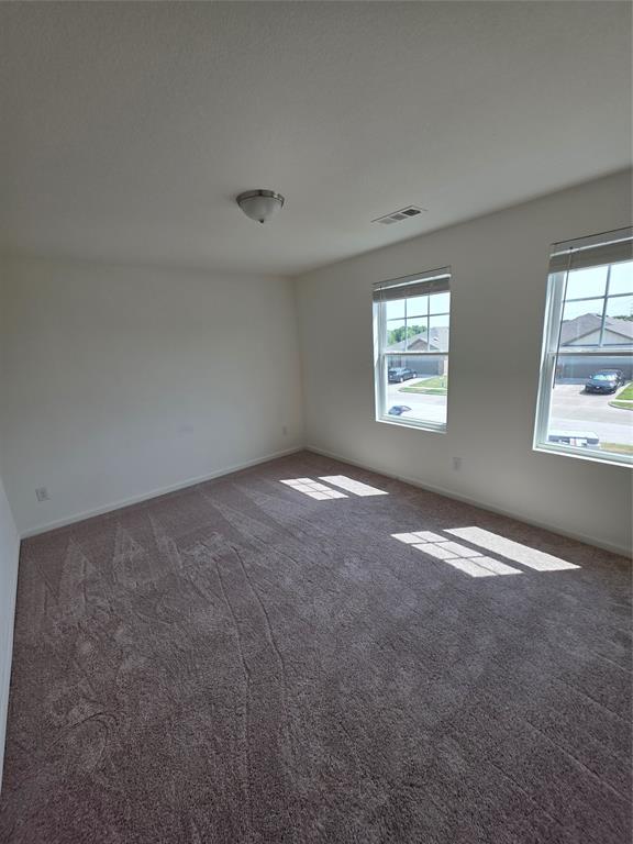 477 Bank Way Crowley, TX 76036 - Photo 16 of 39 Spare room featuring carpet and baseboards