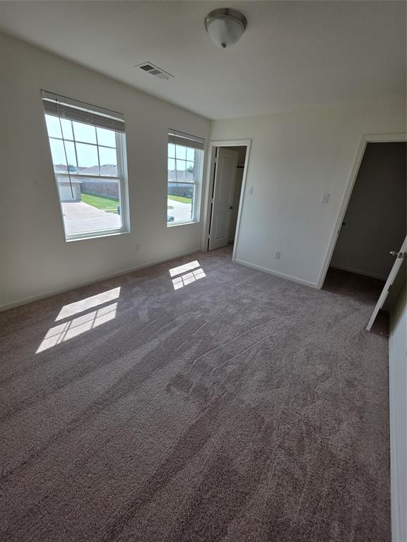 477 Bank Way Crowley, TX 76036 - Photo 17 of 39 Unfurnished bedroom featuring carpet floors and baseboards