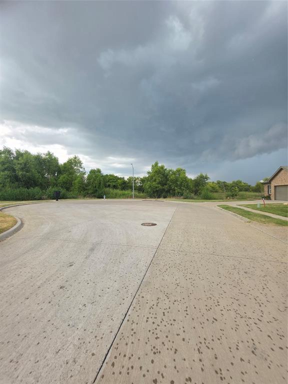 477 Bank Way Crowley, TX 76036 - Photo 36 of 39 View of concrete road featuring curbs