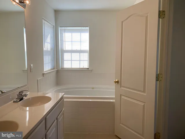 a bathroom with a sink and a bathtub