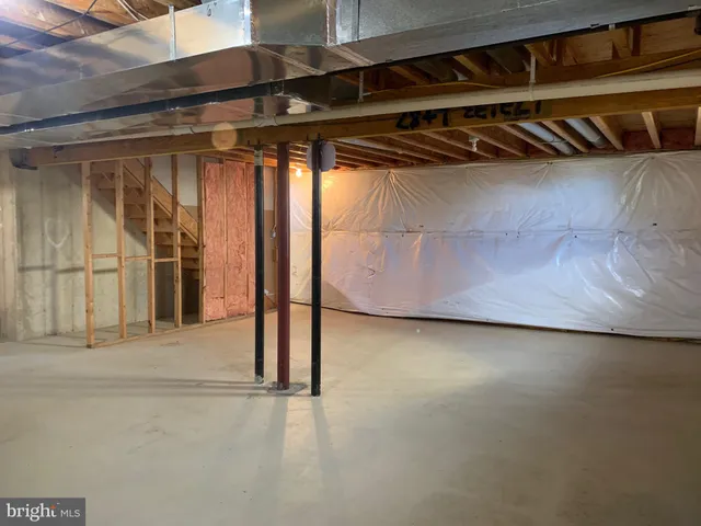 a view of a room with wooden walls