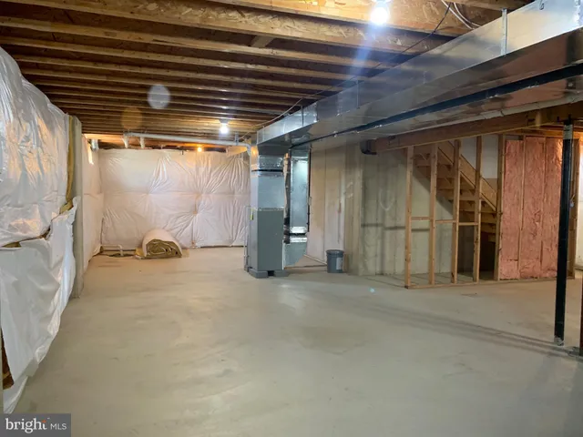 a view of empty room with wooden walls