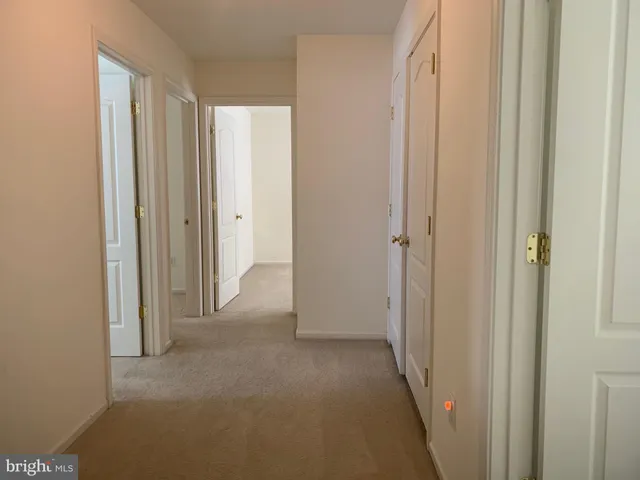 a view of a hallway with closet area