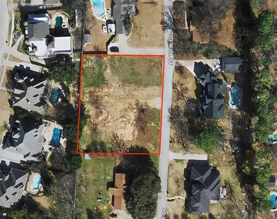 an aerial view of residential houses with outdoor space