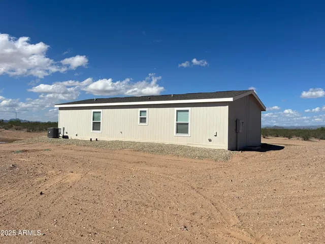 a big house with a big yard and large trees