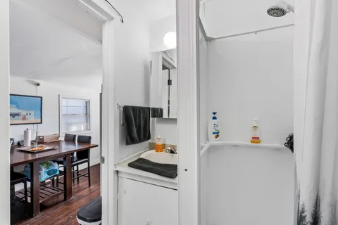 a view of a storage and utility room with washer and dryer
