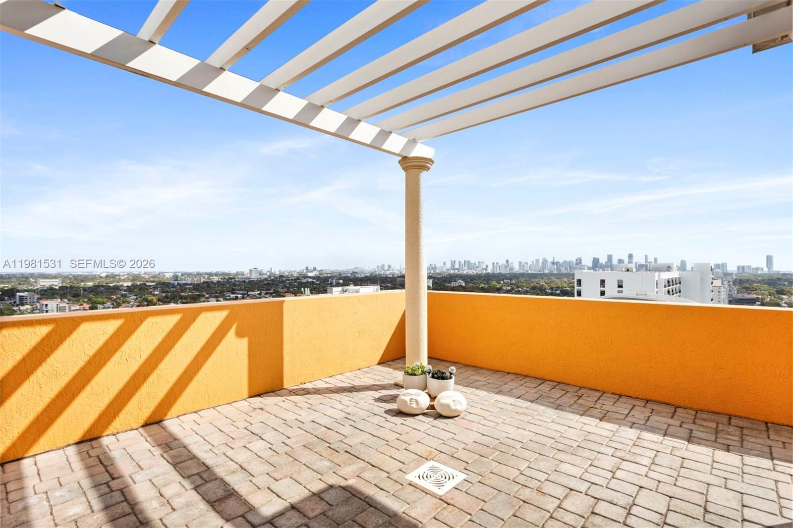 3232 Southwest 22nd Terrace, Unit PH2002 Miami, FL 33145 - Photo 13 of 35 a view of an ocean and beach