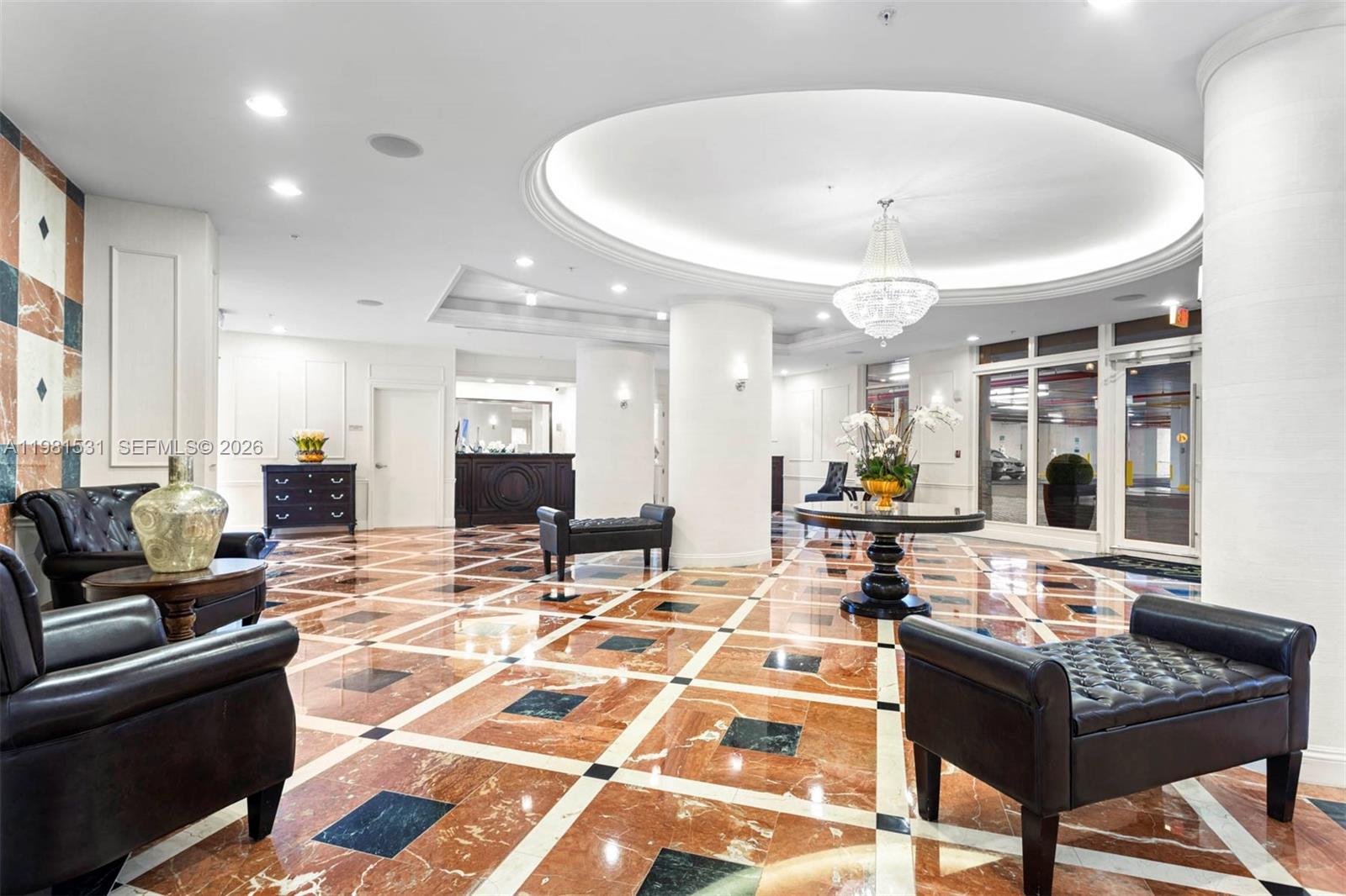 3232 Southwest 22nd Terrace, Unit PH2002 Miami, FL 33145 - Photo 2 of 35 a living room with furniture and a table