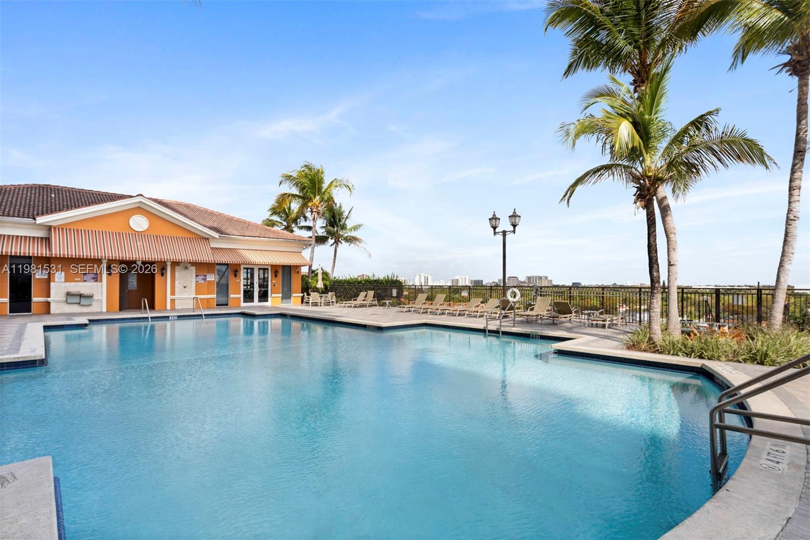 3232 Southwest 22nd Terrace, Unit PH2002 Miami, FL 33145 - Photo 30 of 35 a front view of a house with swimming pool having outdoor seating