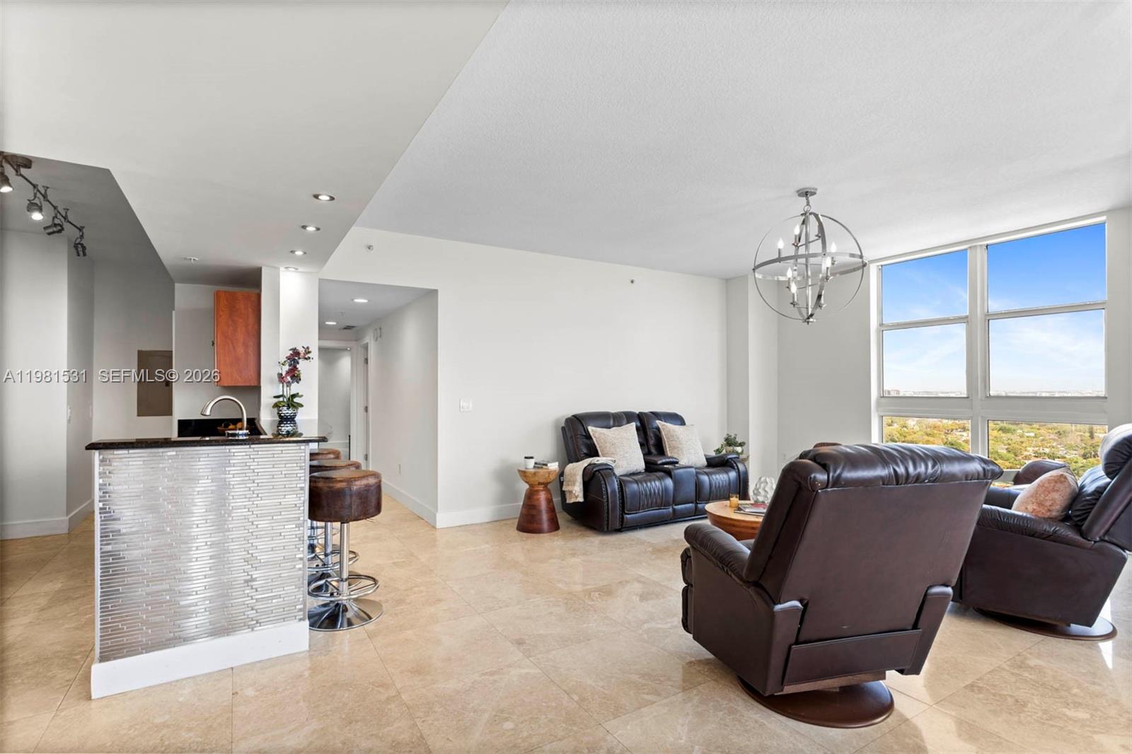 3232 Southwest 22nd Terrace, Unit PH2002 Miami, FL 33145 - Photo 3 of 35 a living room with furniture