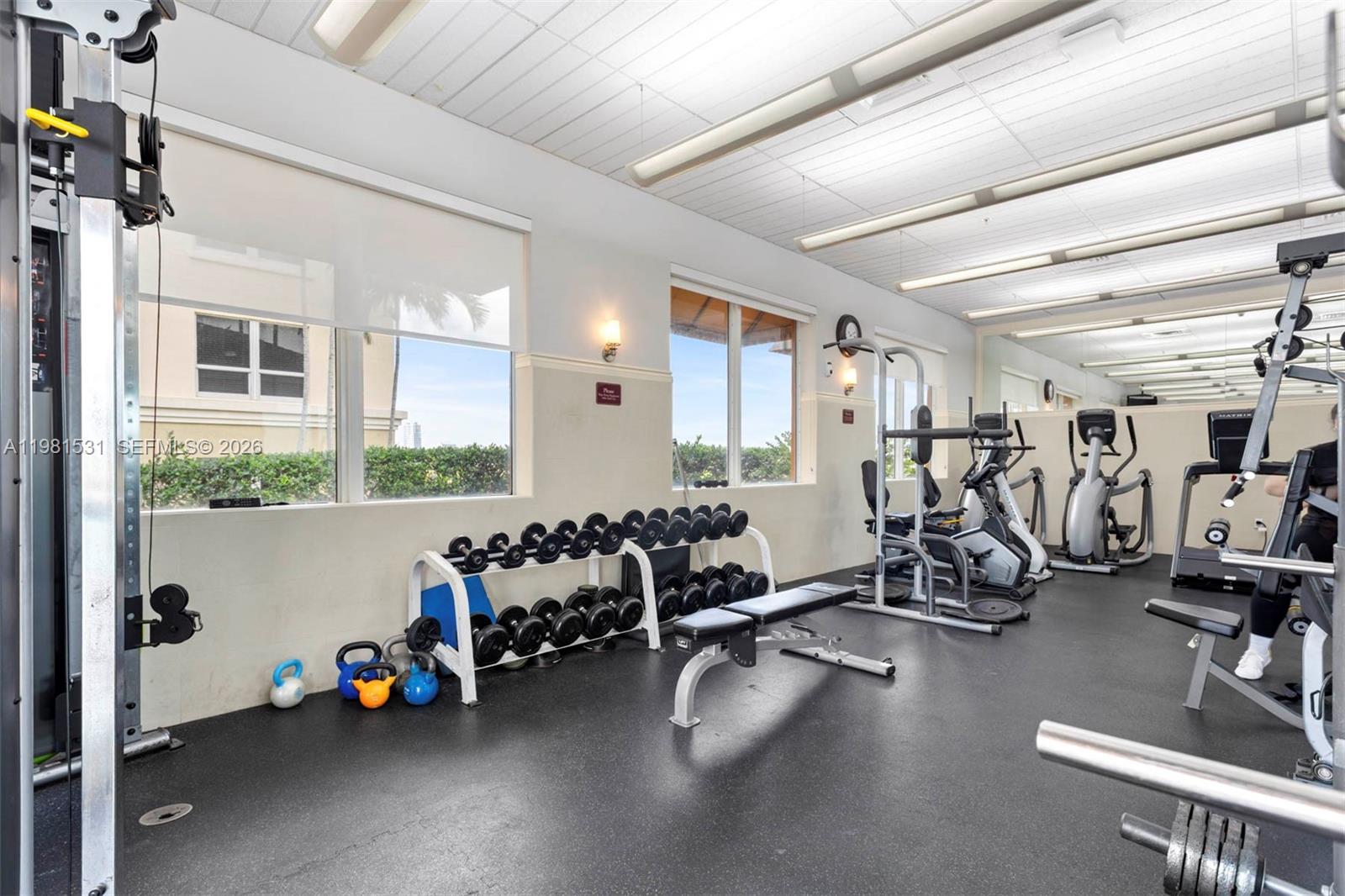 3232 Southwest 22nd Terrace, Unit PH2002 Miami, FL 33145 - Photo 31 of 35 a view of a room with gym equipment