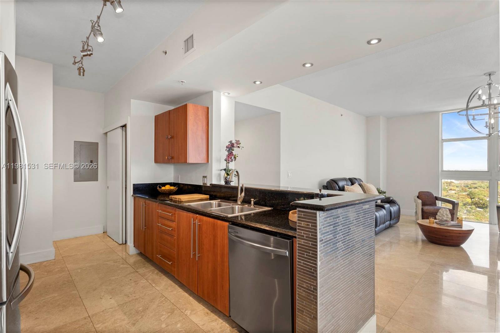 3232 Southwest 22nd Terrace, Unit PH2002 Miami, FL 33145 - Photo 4 of 35 a kitchen that has a sink and a stove