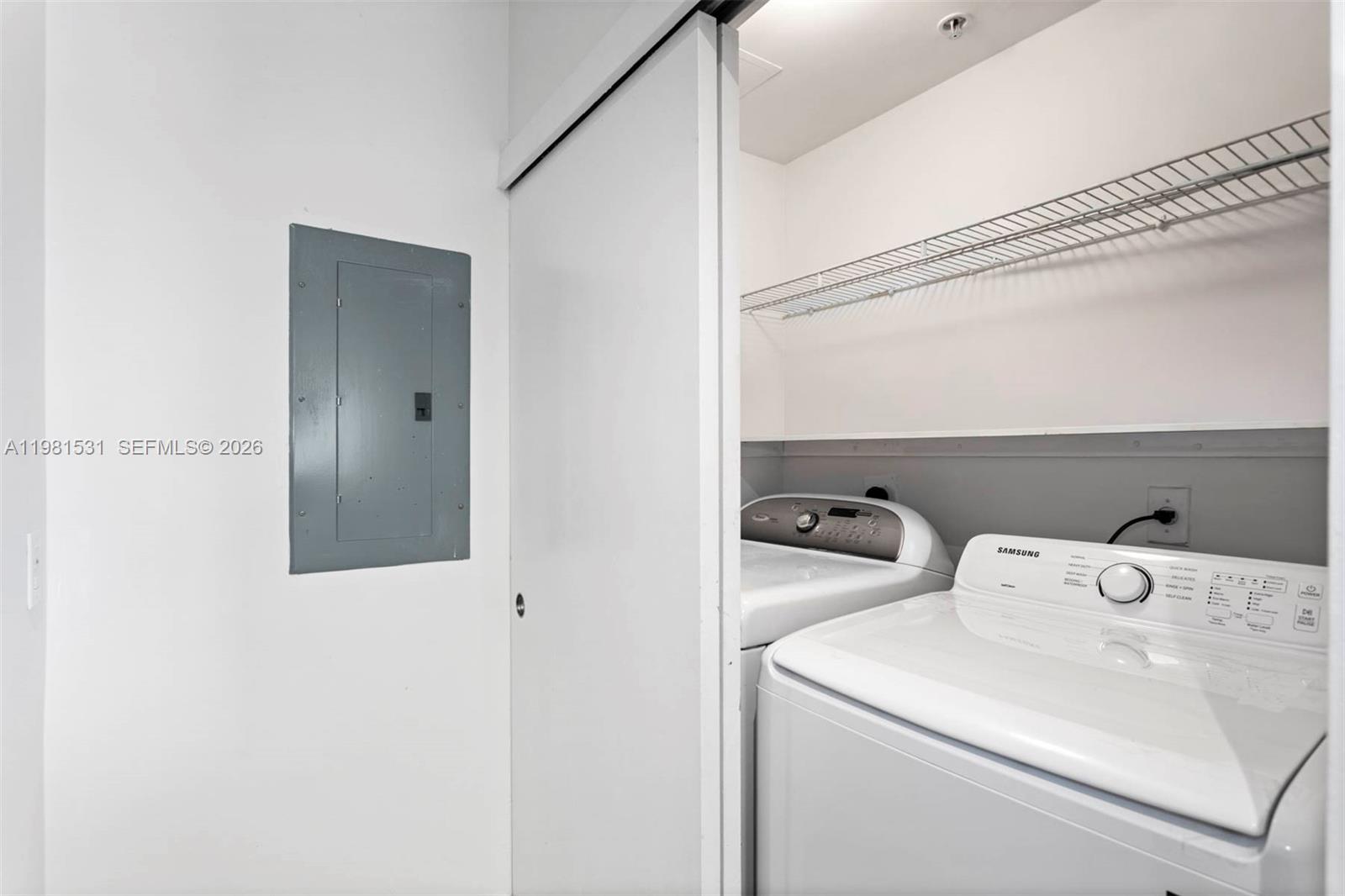 3232 Southwest 22nd Terrace, Unit PH2002 Miami, FL 33145 - Photo 6 of 35 a utility room with dryer and washer