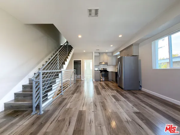 a view of entryway with wooden floor