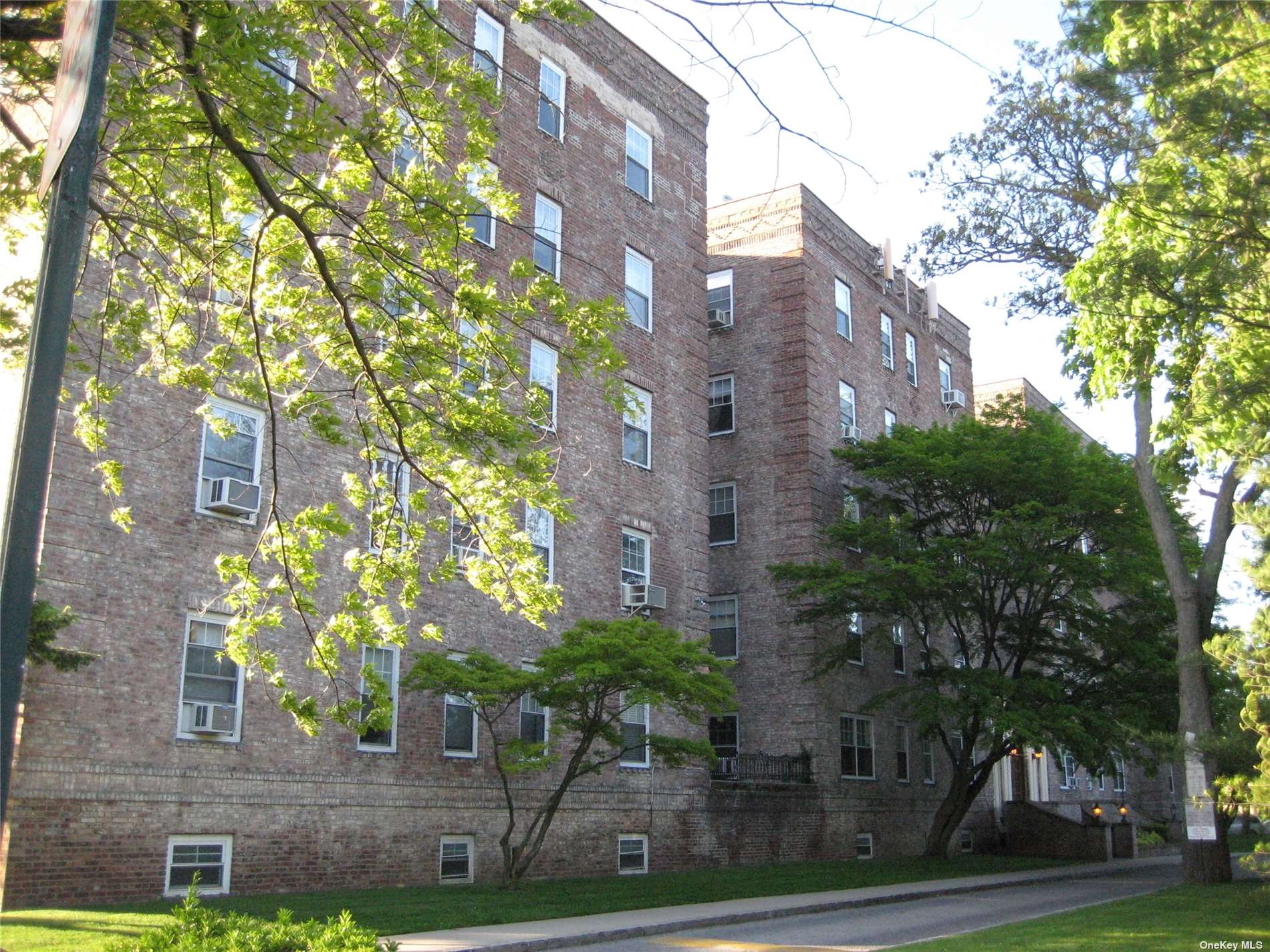 a front view of a multi story residential apartment buildings