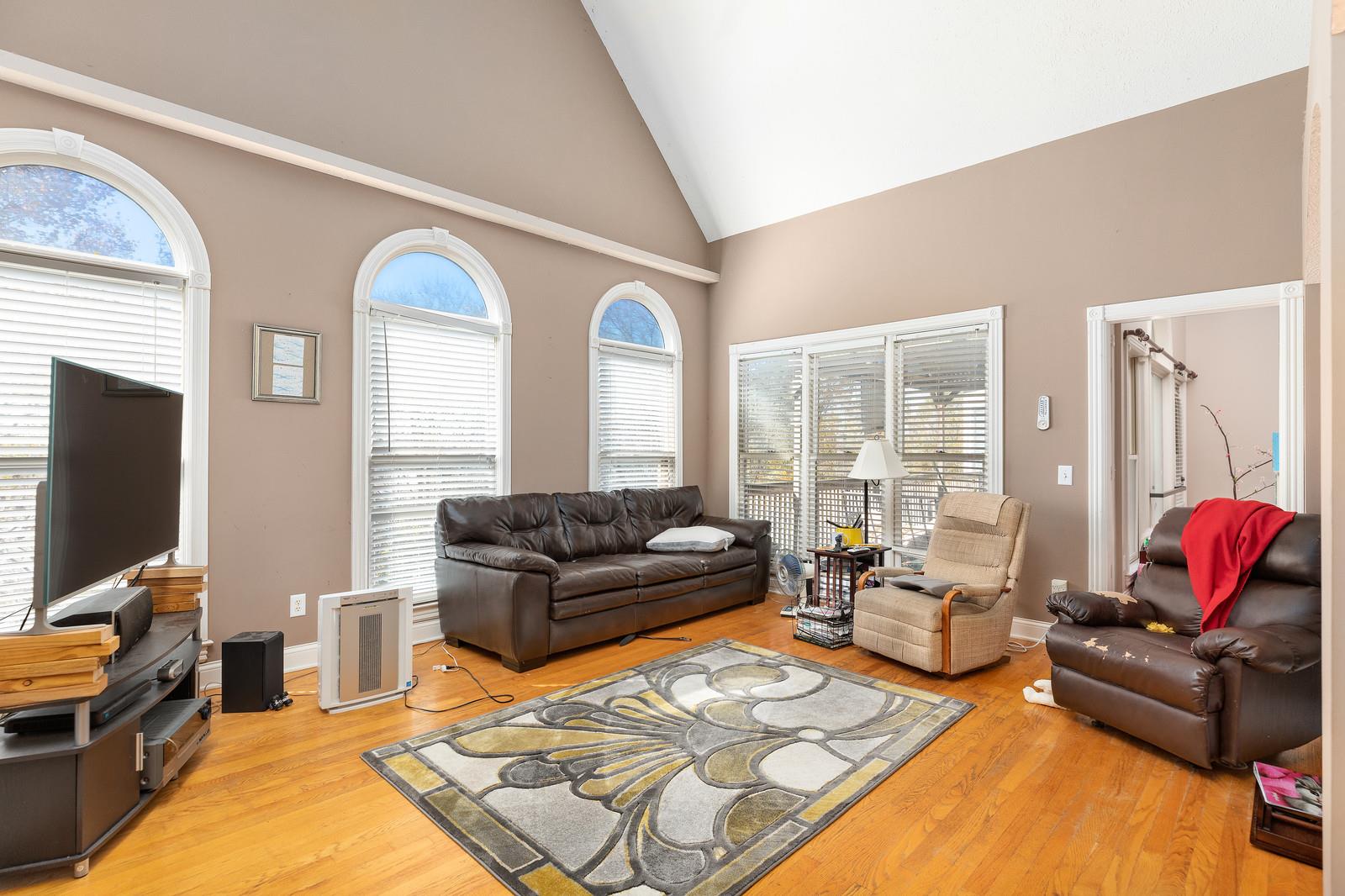 133 East Robertson Road Castalian Springs, TN 37031 - Photo 11 of 28 Living room with lots of natural light and tall cathedral ceiling.