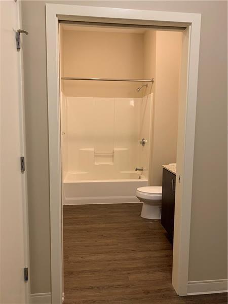 1655 Fifth Avenue, Unit 312 Pittsburgh, PA 15219 - Photo 11 of 29 a bathroom with a toilet a sink and shower