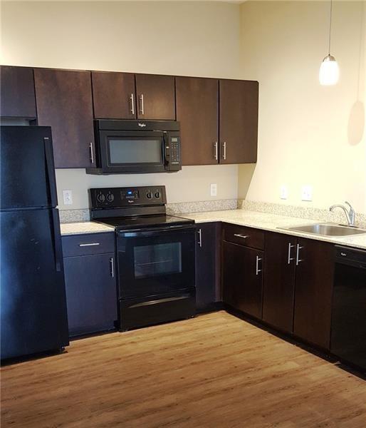 1655 Fifth Avenue, Unit 312 Pittsburgh, PA 15219 - Photo 17 of 29 a kitchen with a sink and a stove
