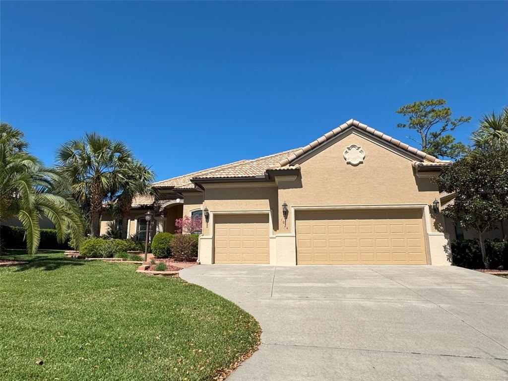 1024 West Beagle Run Loop Hernando, FL 34442 - Photo 1 of 44 a front view of a house with a yard