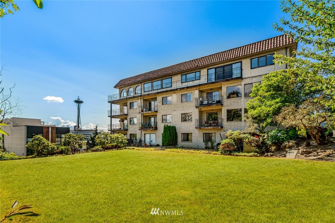 610 Aloha Street, Unit 302 Seattle, WA 98109 - Photo 2 of 27 a view of a building with a garden