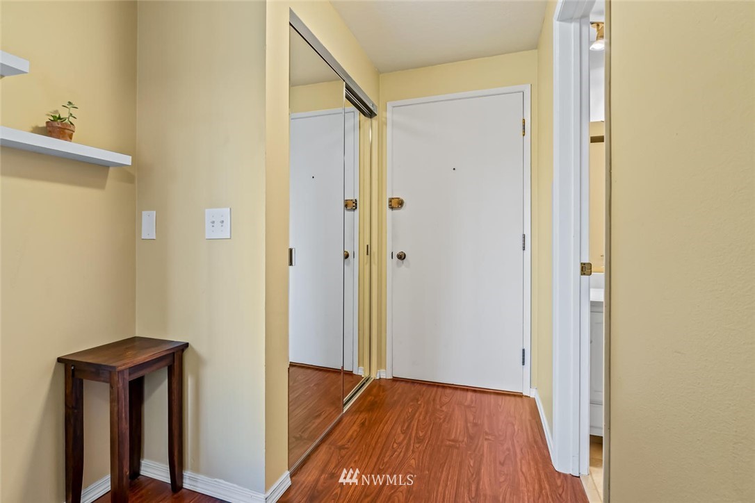 610 Aloha Street, Unit 302 Seattle, WA 98109 - Photo 5 of 27 a view of a hallway with wooden floor