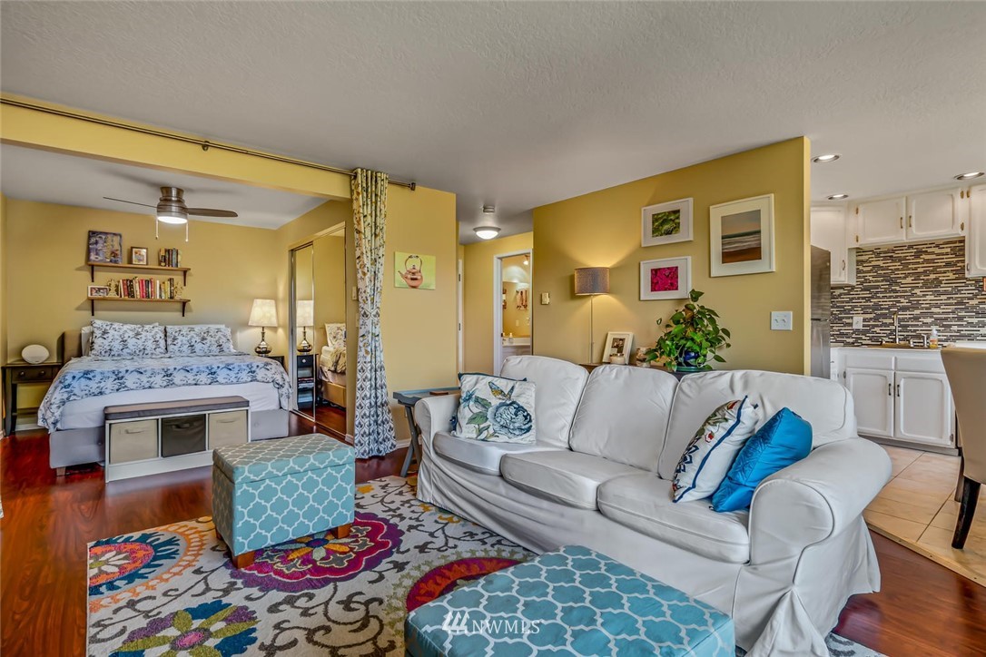610 Aloha Street, Unit 302 Seattle, WA 98109 - Photo 9 of 27 a living room with furniture and a fireplace