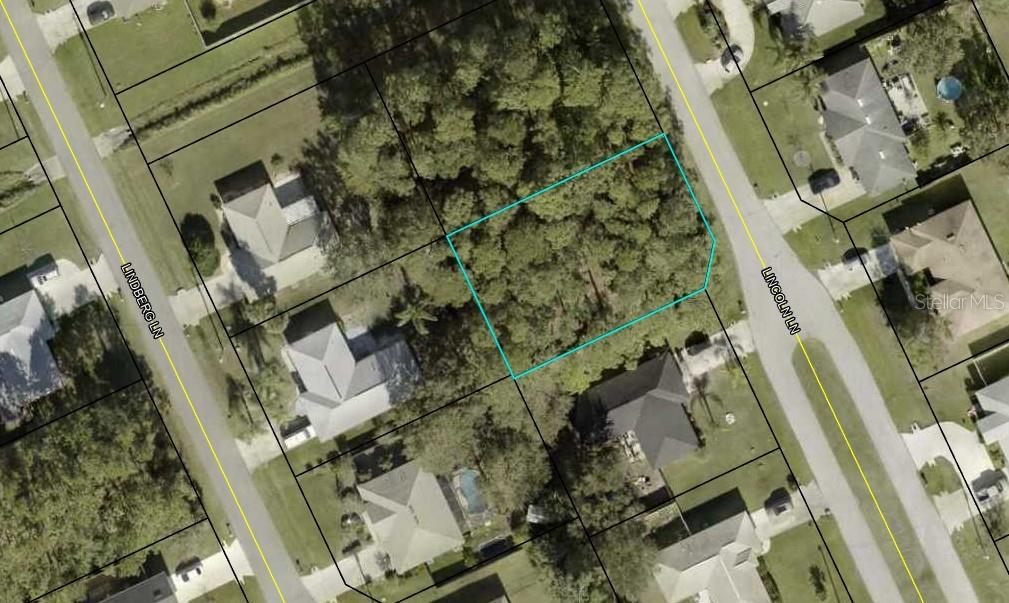 13 Lincoln Lane Palm Coast, FL 32137 - Photo 5 of 7 an aerial view of a residential apartment building with a yard