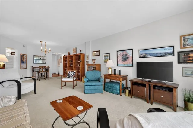 a view of a livingroom with furniture and staircase