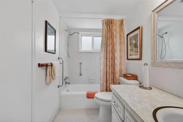 a view of a livingroom with furniture and a window