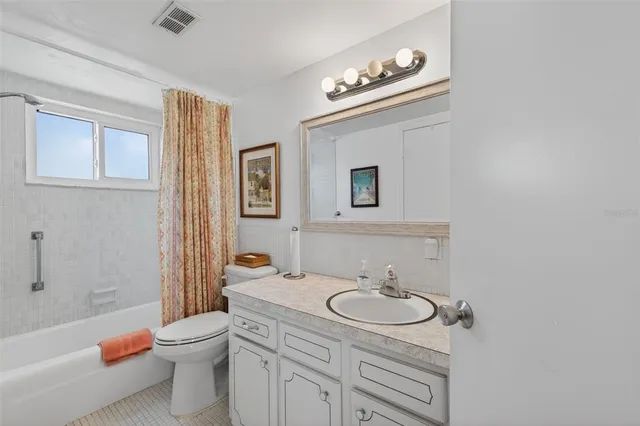 a kitchen with stainless steel appliances a sink and cabinets