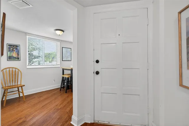 a kitchen with cabinets a sink and white appliances
