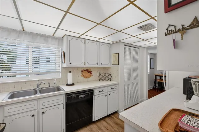 a view of a big building with a big yard and plants