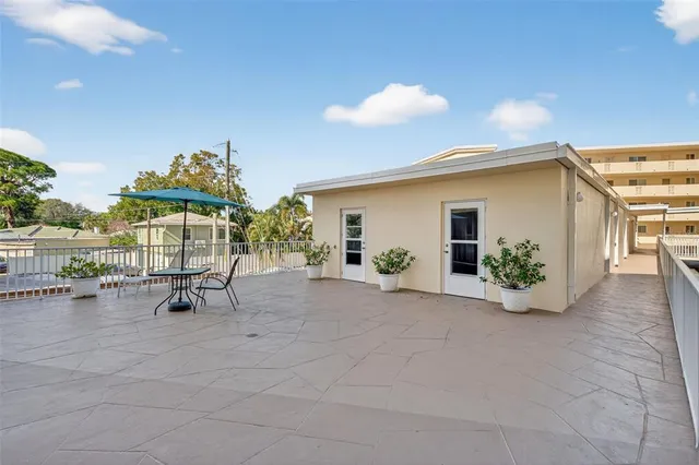 a view of a livingroom with furniture and a window