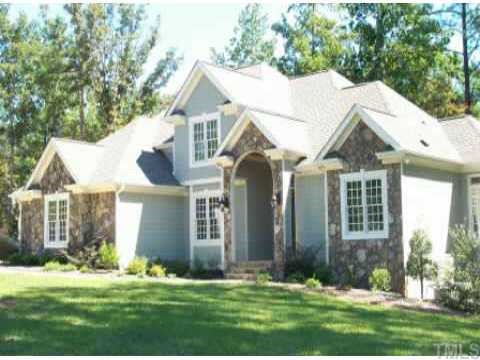 6608 Swallowtail Lane Raleigh, NC 27613 - Photo 1 of 1 a front view of a house with a yard