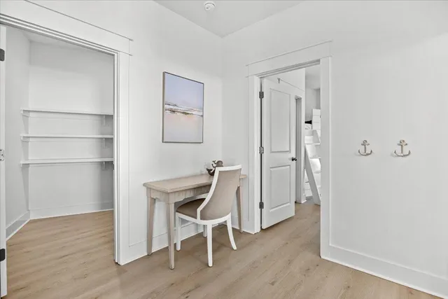 a bathroom with a sink a toilet a mirror and shower