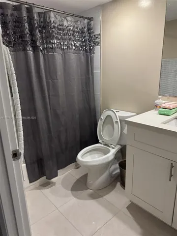 a bathroom with a toilet and a sink
