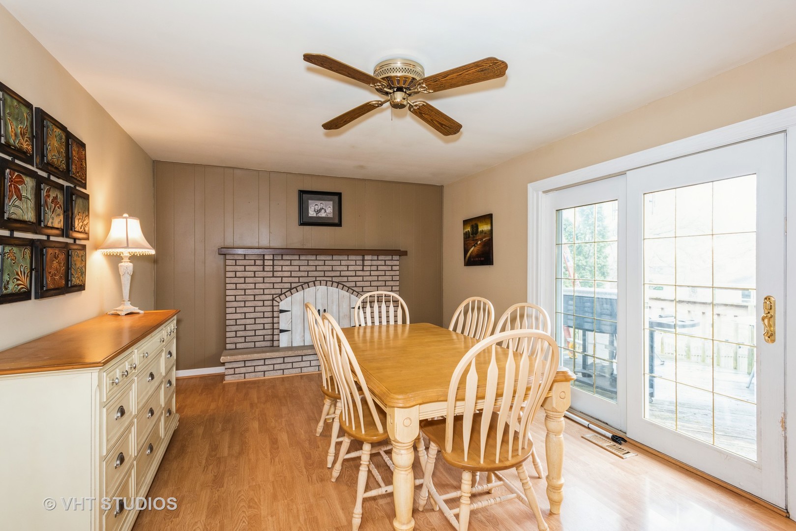 7 Green Ridge Road Elgin, IL 60120 - Photo 5 of 11 a dining room with furniture a fireplace and wooden floor