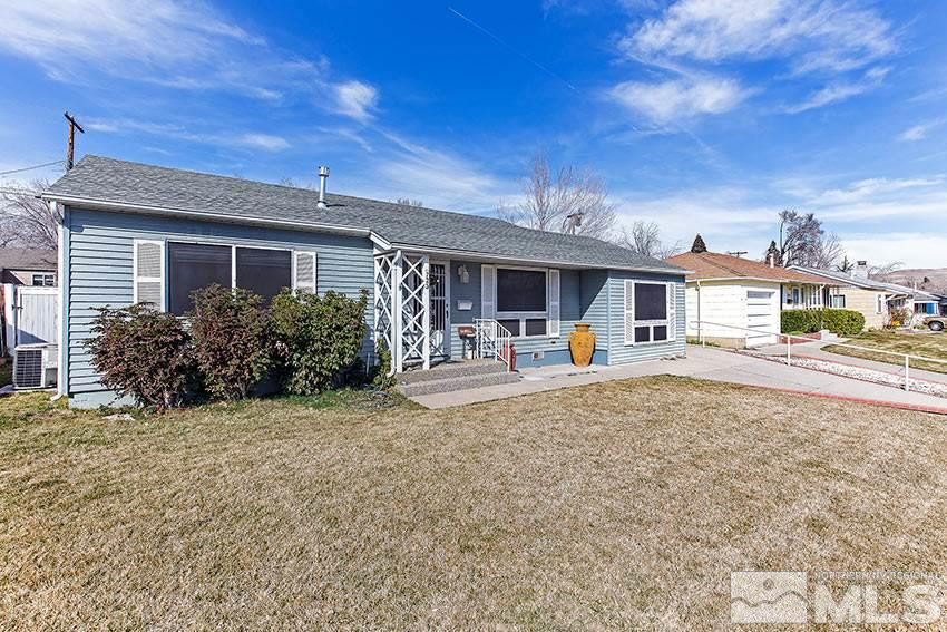 725 Reeves Avenue Reno, NV 89503 - Photo 1 of 15 a view of a house with backyard porch and sitting area